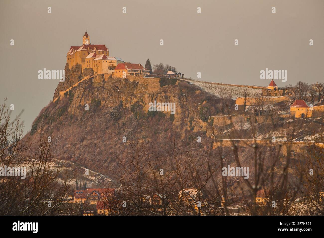 Castle Riegersburg in Styria, Austria on a sunny but cold winter day with  some snow visible. Sun lit medeival castle in Austria on the edge of a  cliff Stock Photo - Alamy