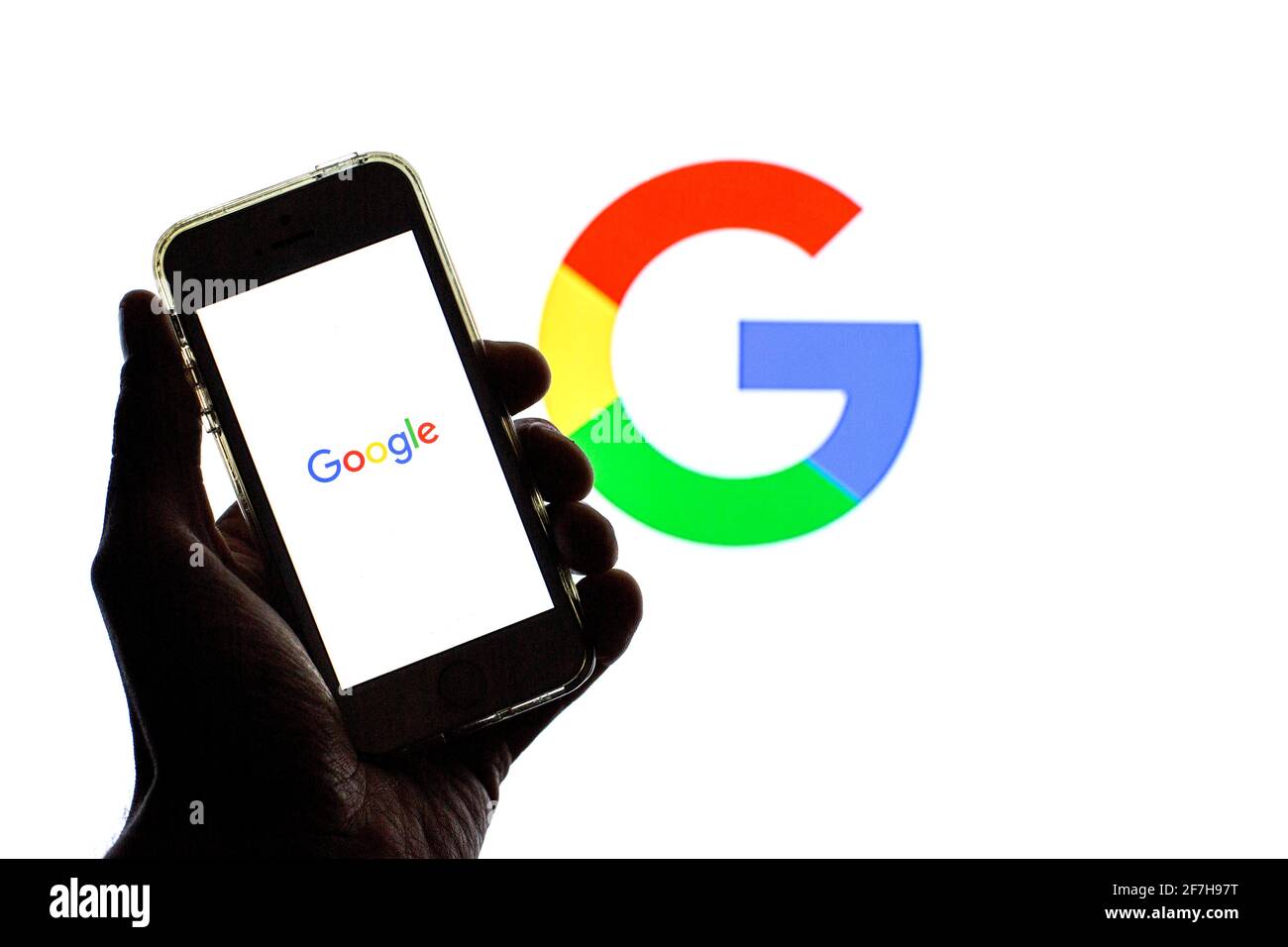 Barcelona, Catalonia, Spain. 7th Apr, 2021. In this photo illustration, the Google app seen displayed on a smartphone screen and a Google logo in the background. Credit: Thiago Prudencio/DAX/ZUMA Wire/Alamy Live News Stock Photo