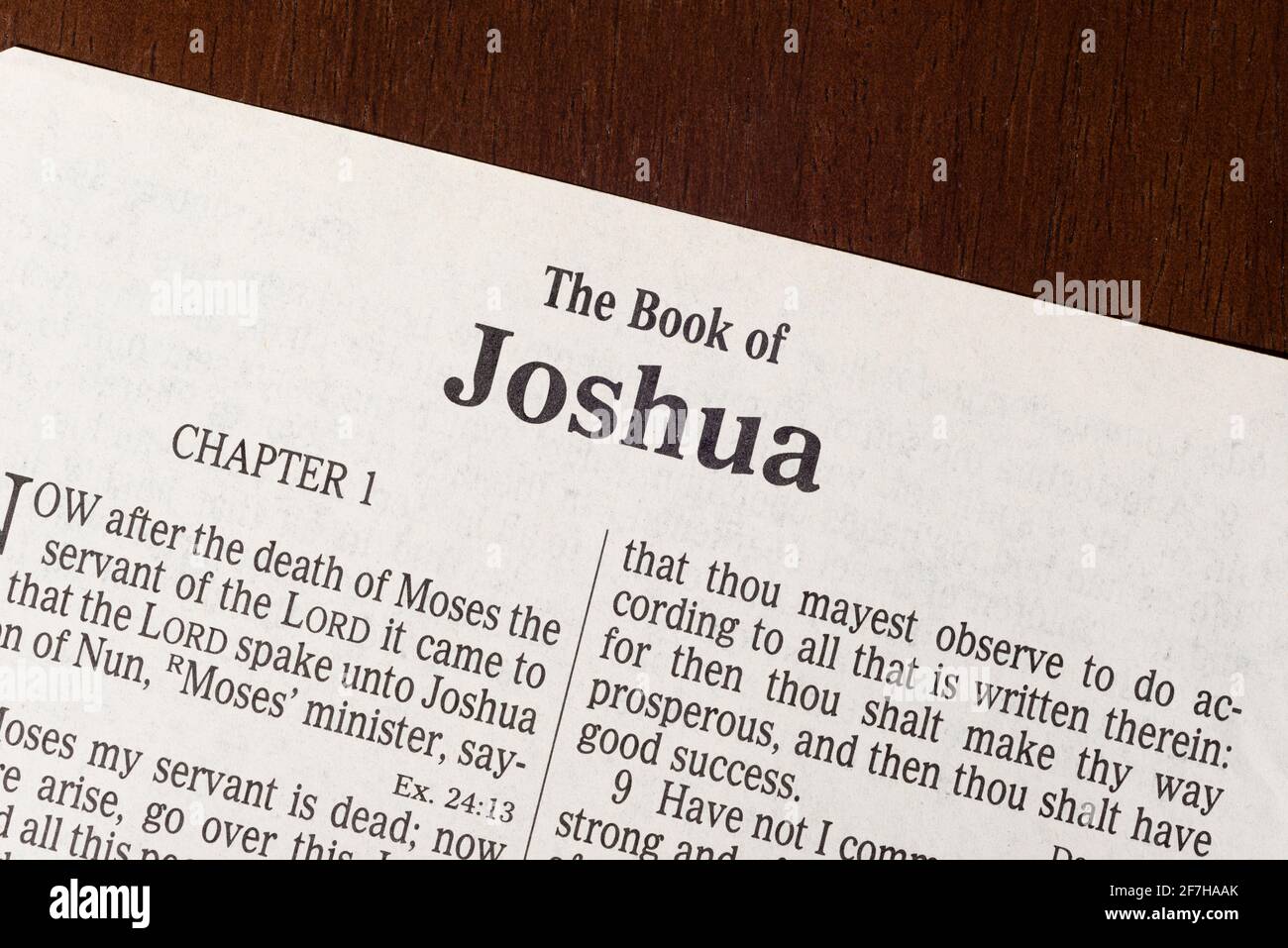 This is the King James Bible translated in 1611.  There is no copyright.  A razor-sharp macro photograph of the first page of the book of Joshua. Stock Photo