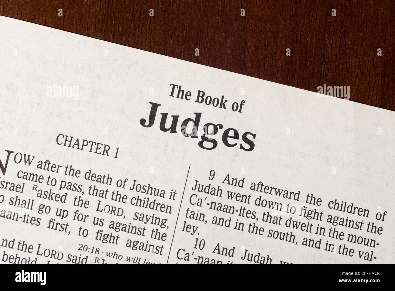 This is the King James Bible translated in 1611.  There is no copyright.  A razor-sharp macro photograph of the first page of the book of Judges. Stock Photo