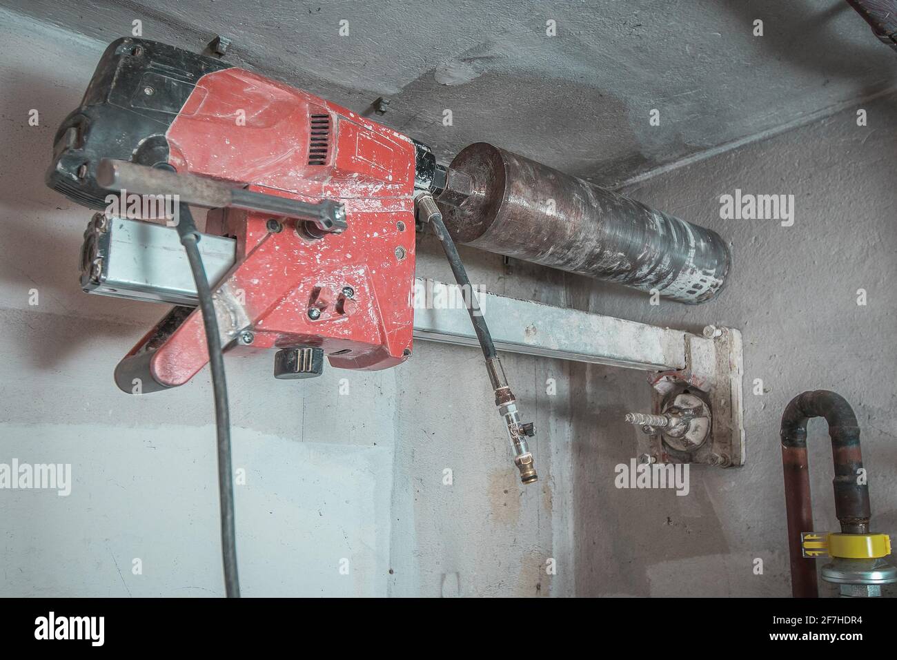 Machine for drilling holes in hthe concrete wall. Red professional