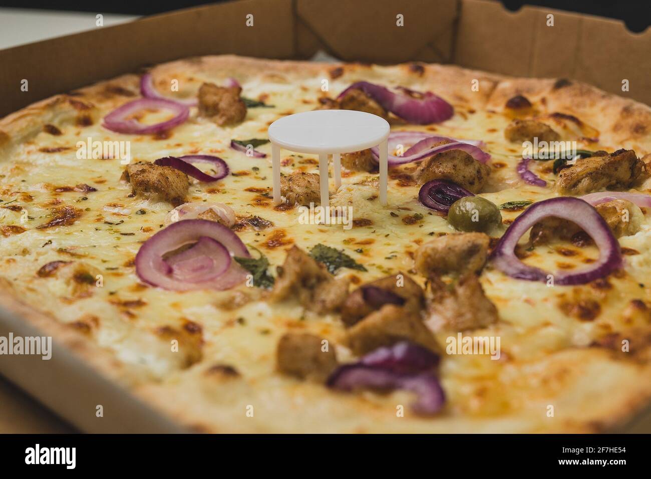 Pizza saver or ottoman, known also as pizza table, used in pizza