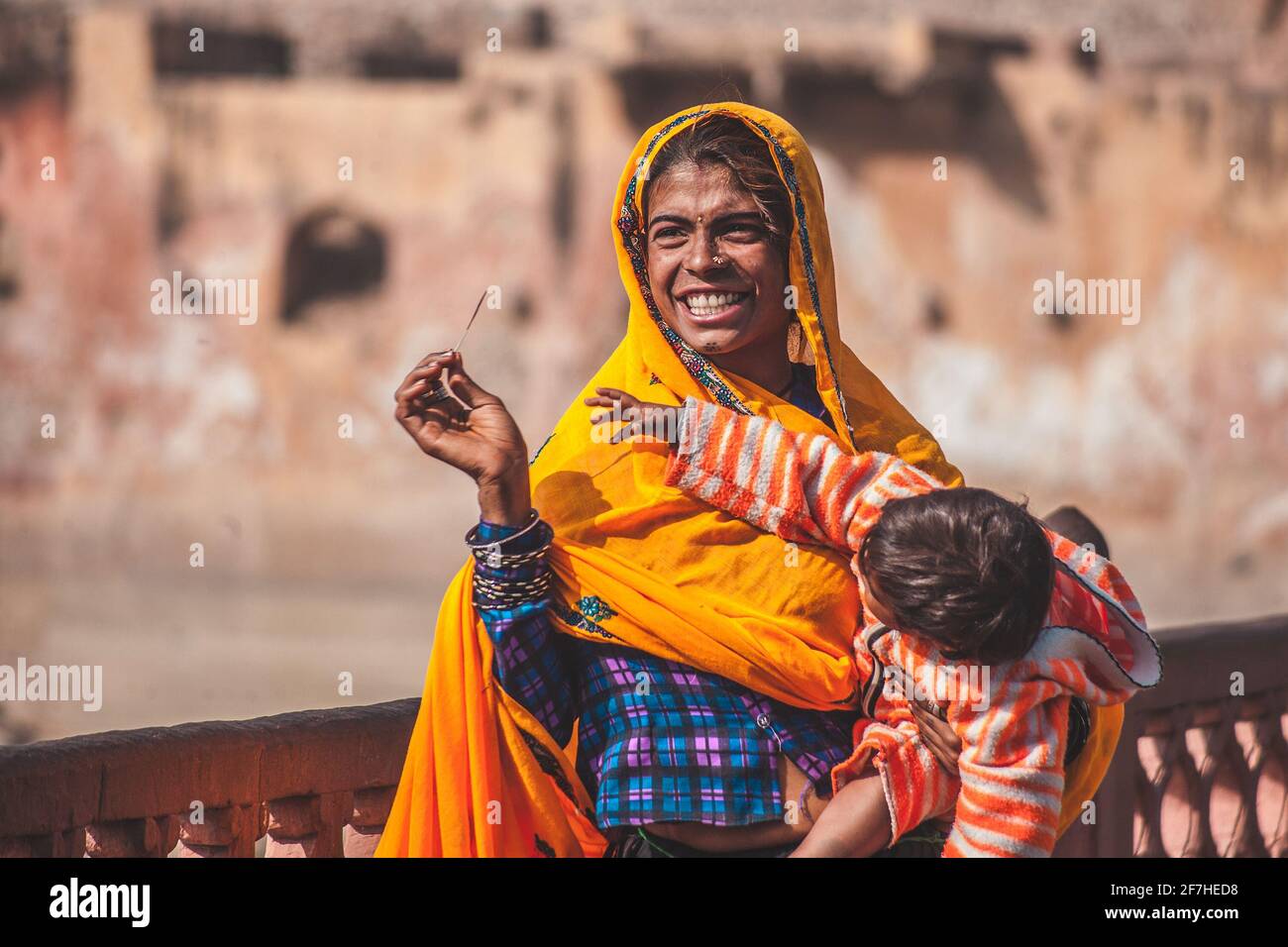 Indian woman carrying baby hi-res stock photography and images - Alamy