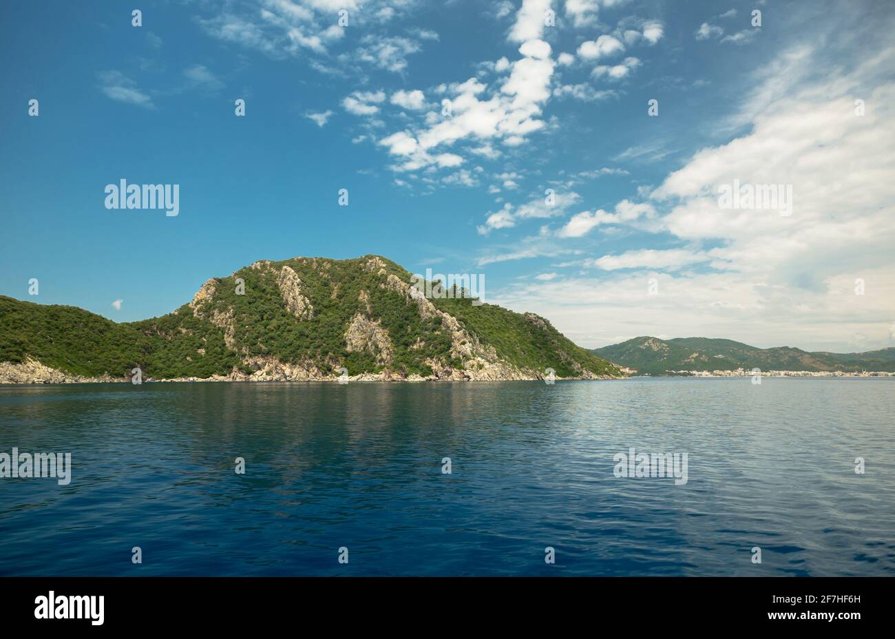 Lagoon in the background of hills and rocks Stock Photo - Alamy