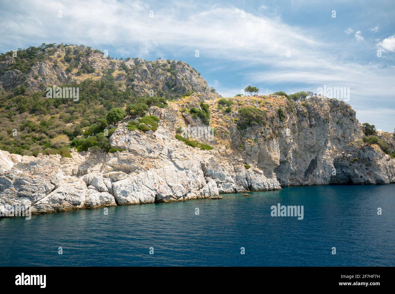 Lagoon in the background of hills and rocks Stock Photo - Alamy