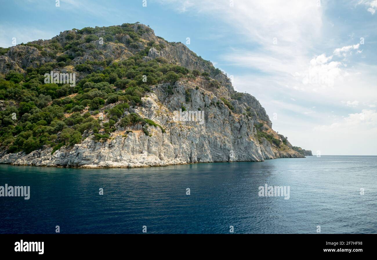 Lagoon in the background of hills and rocks Stock Photo - Alamy