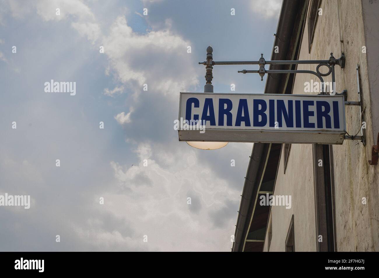 An old illuminated sign board for Carabinieri, a part of an italian police force. Board is hanging from a wall in a house Stock Photo