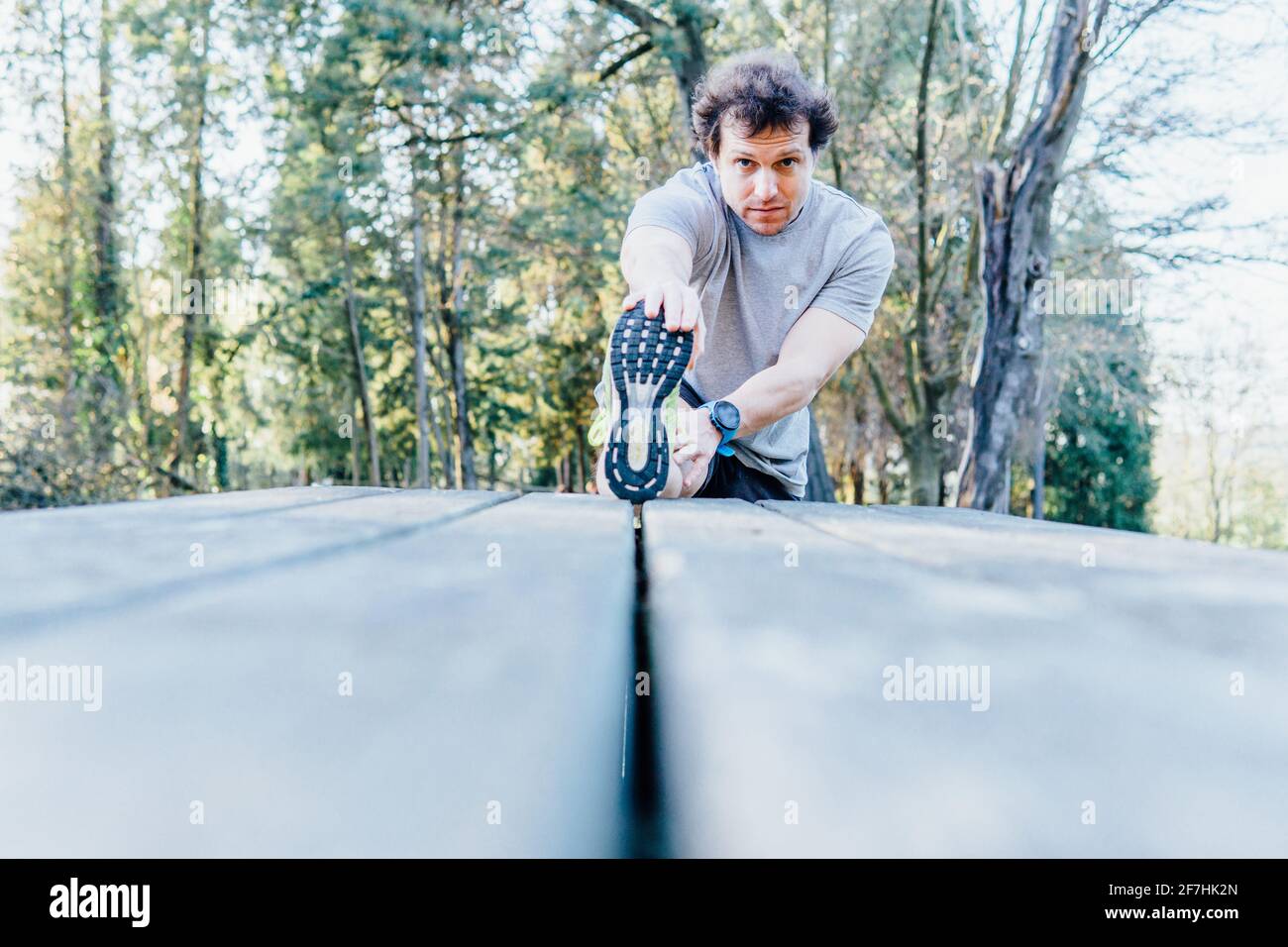 Young man stretching on terrace hi-res stock photography and images - Alamy