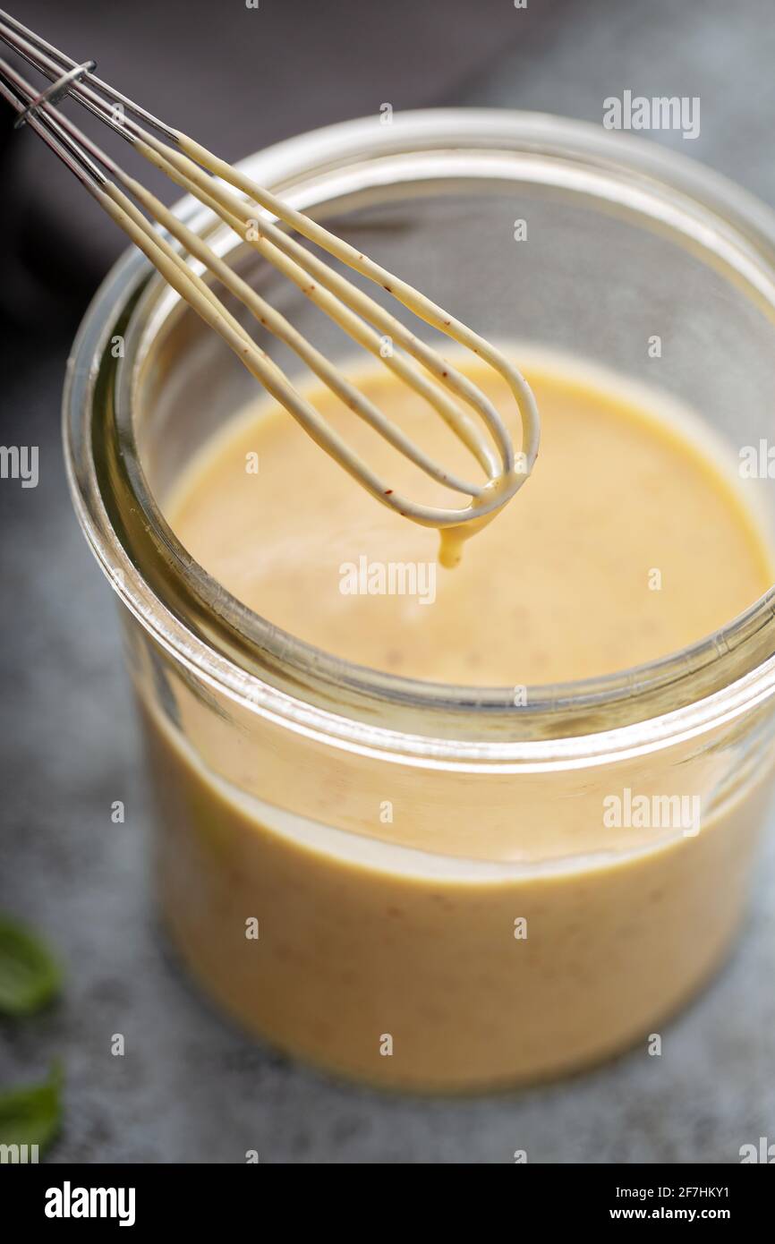 Homemade honey mustard dressing in a glass jar Stock Photo Alamy