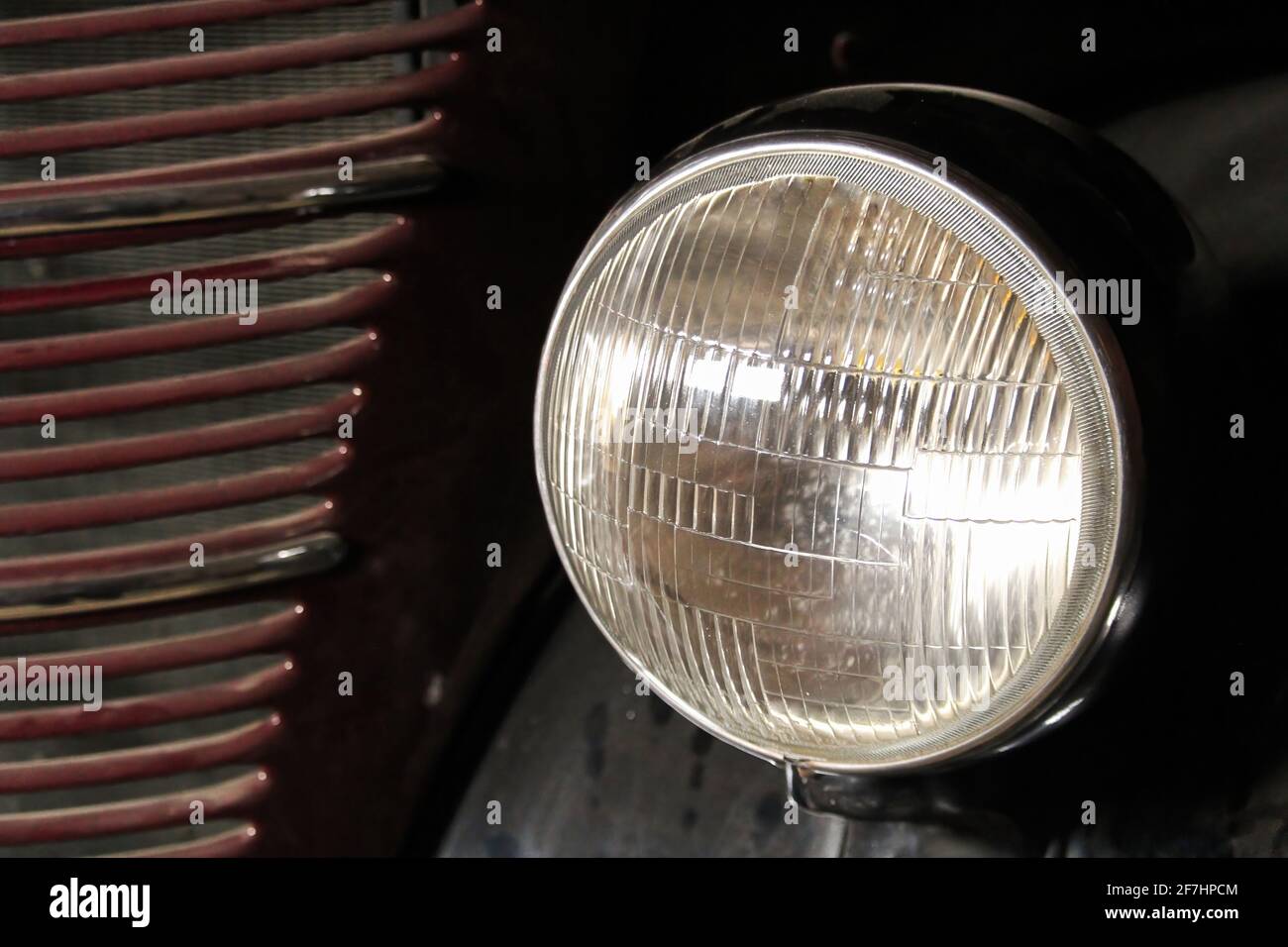 A head light on an old vintage automobile Stock Photo