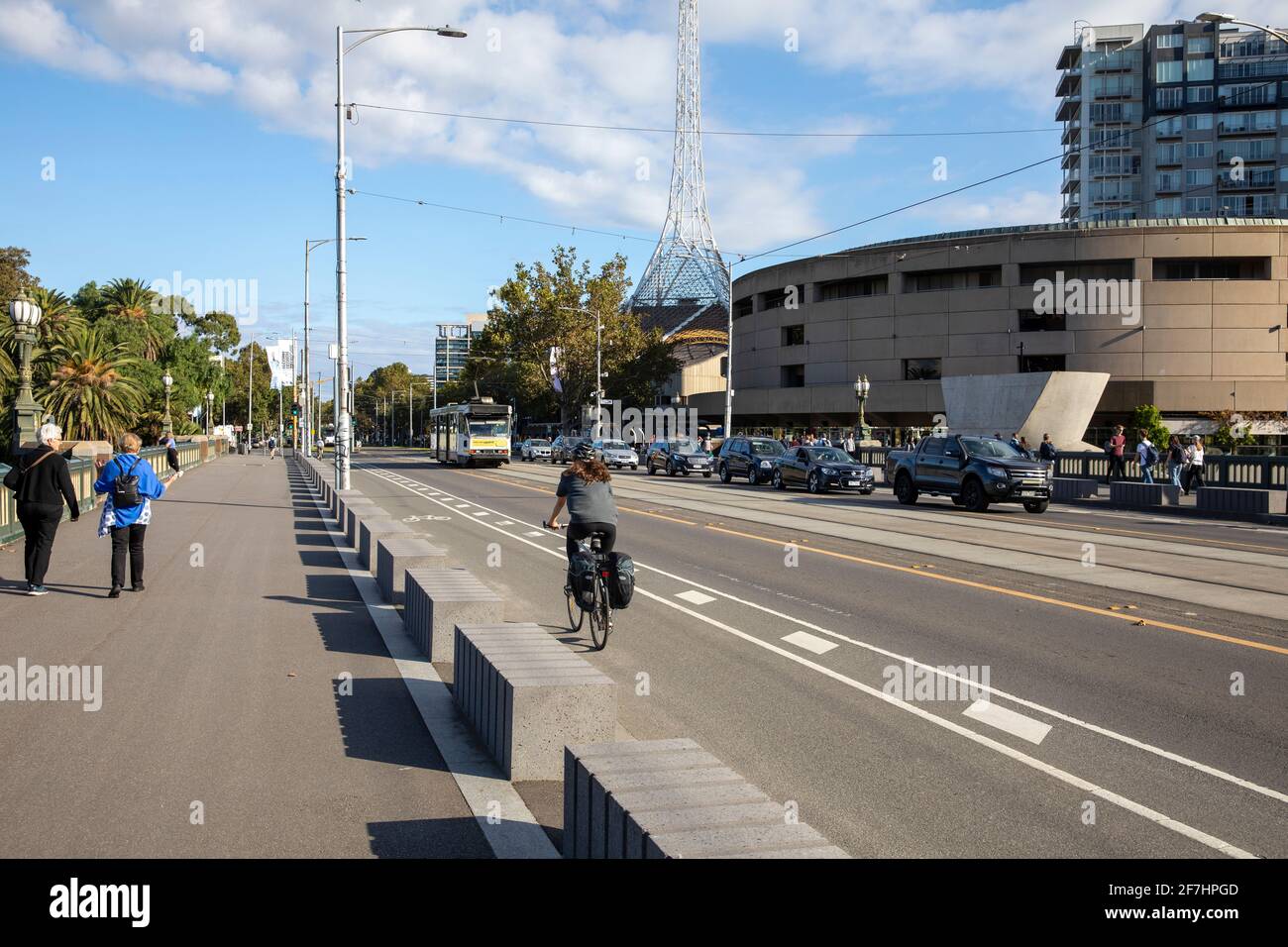 Cyclist riding across Princes bridge in Melbourne city centre,Victoria,Australia Stock Photo