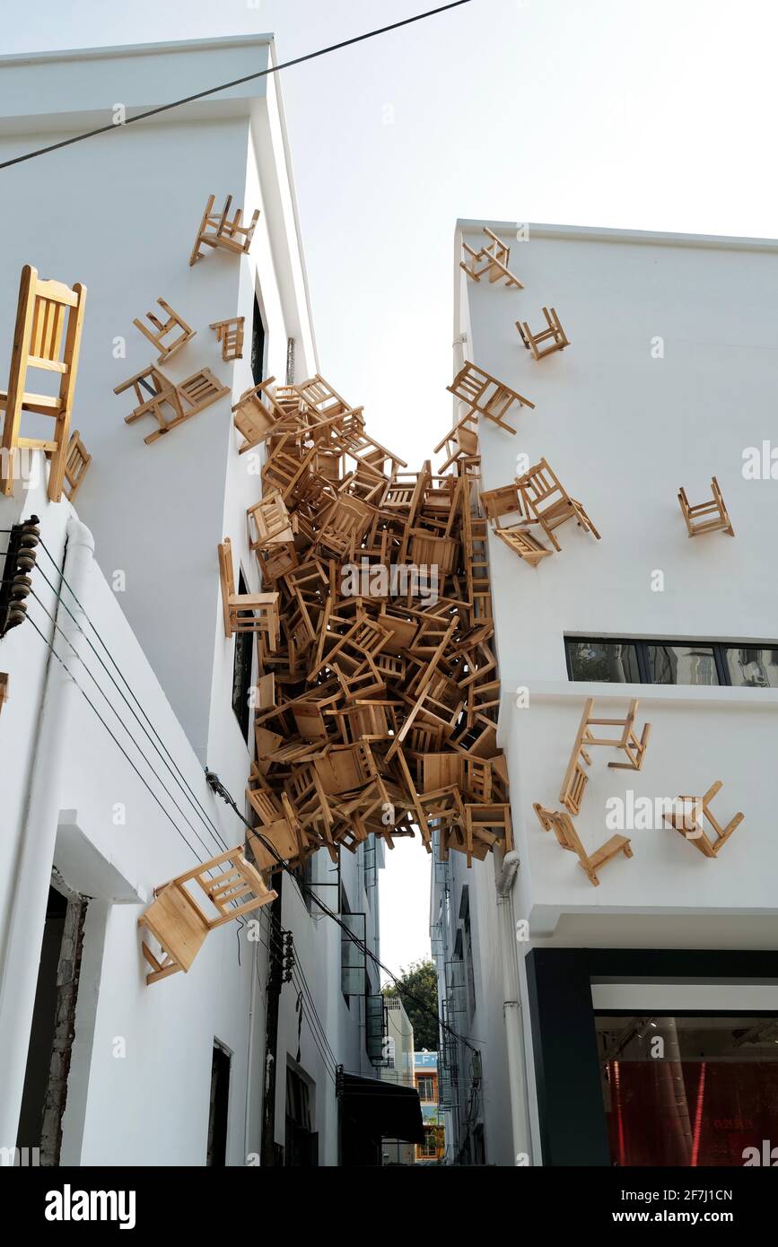 A special designed architecture with lots of wooden chairs laying