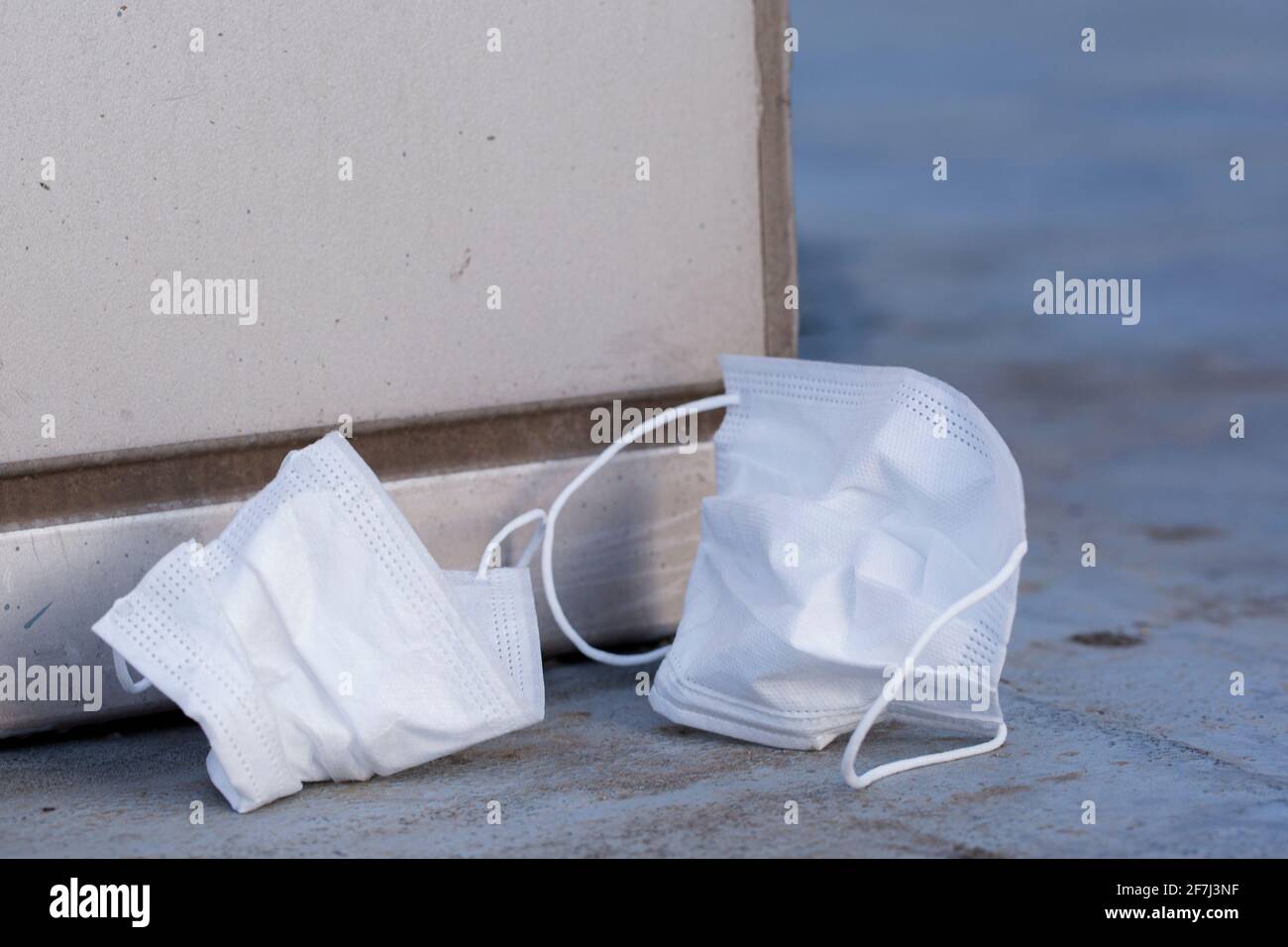 mask disposed, thrown on street Stock Photo