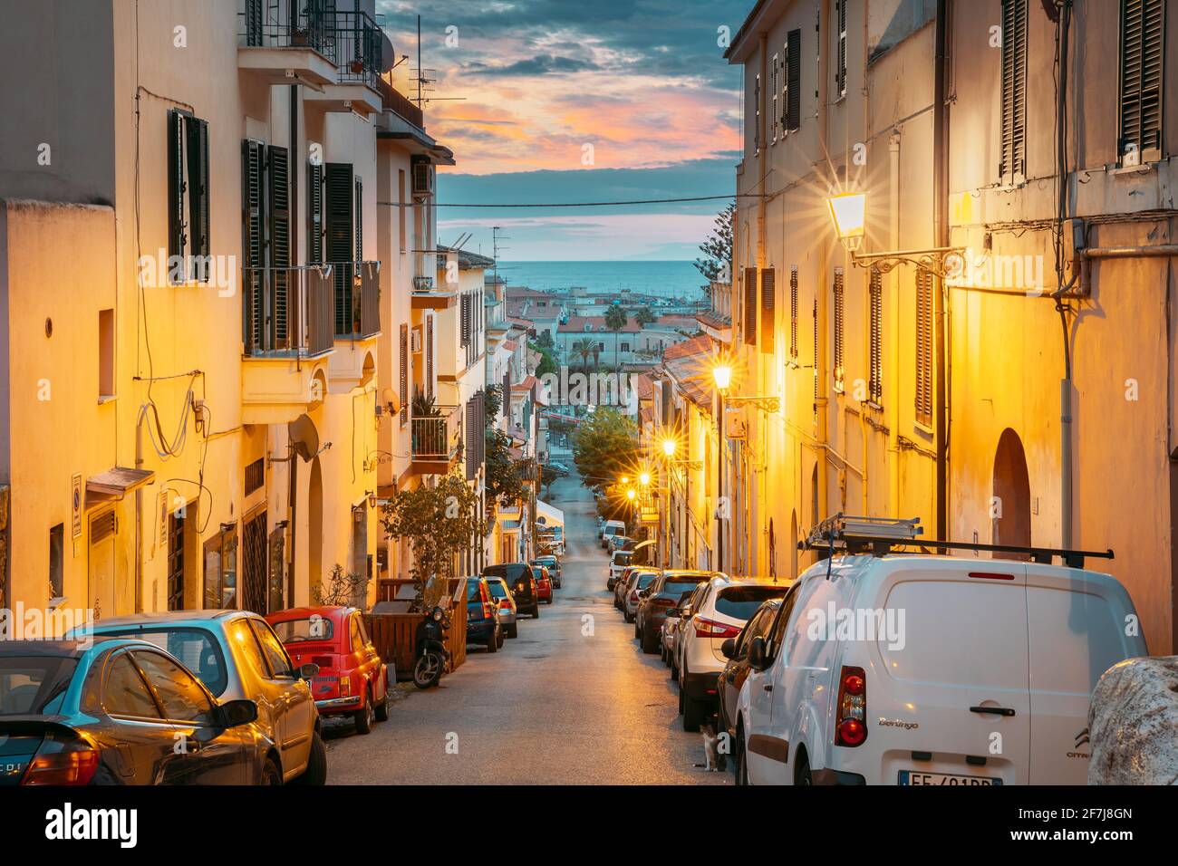Terracina, Italy. Cars Parked On Narrowm Street In European City In Summer Night Stock Photo