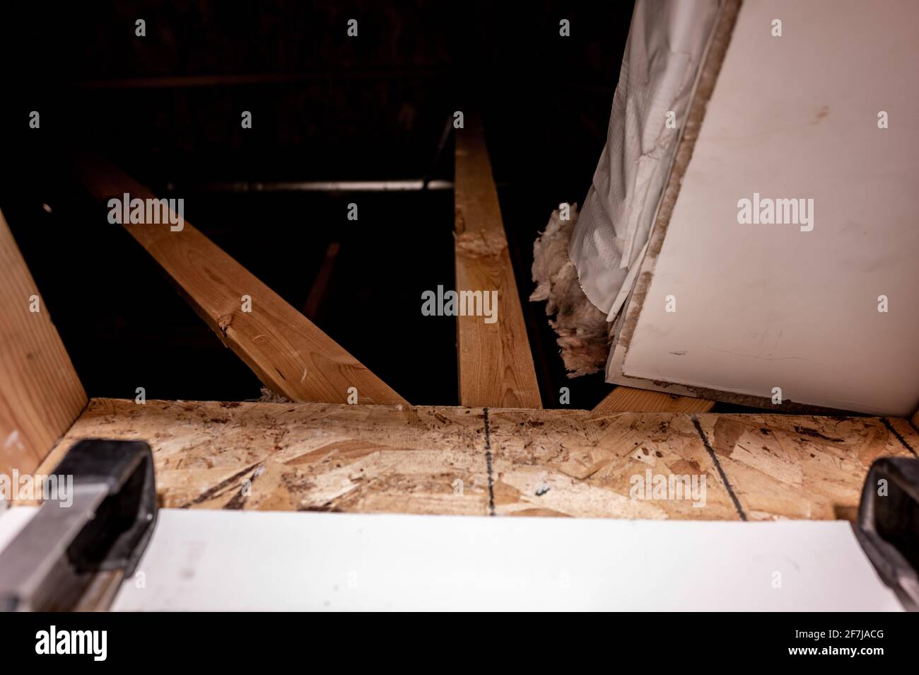 last rung of a ladder below an open attic entrance Stock Photo Alamy