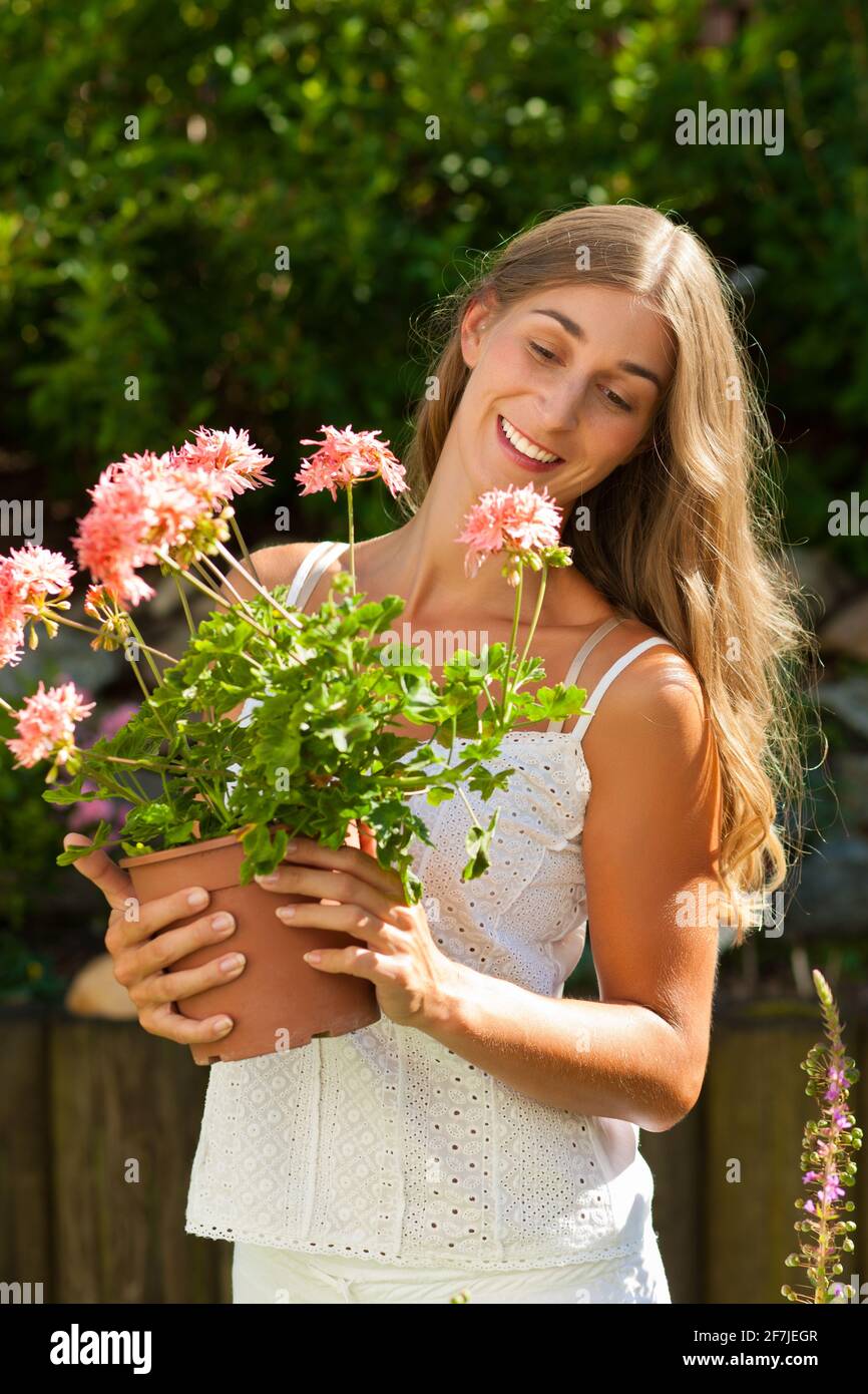 Бел досуг. Happy woman in Garden.