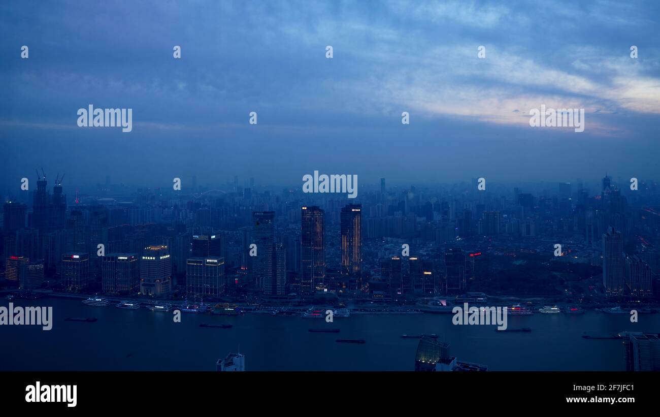 Shanghai city during nightfal with blue tones sky above. Stock Photo