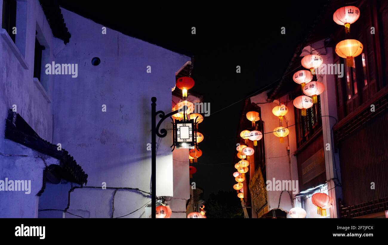 Old houses with lantern and lights on during night in Suzhou Stock Photo