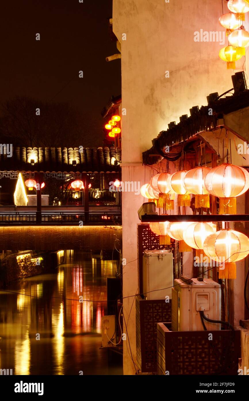 Old houses with lantern and lights on during night in Suzhou. Stock Photo