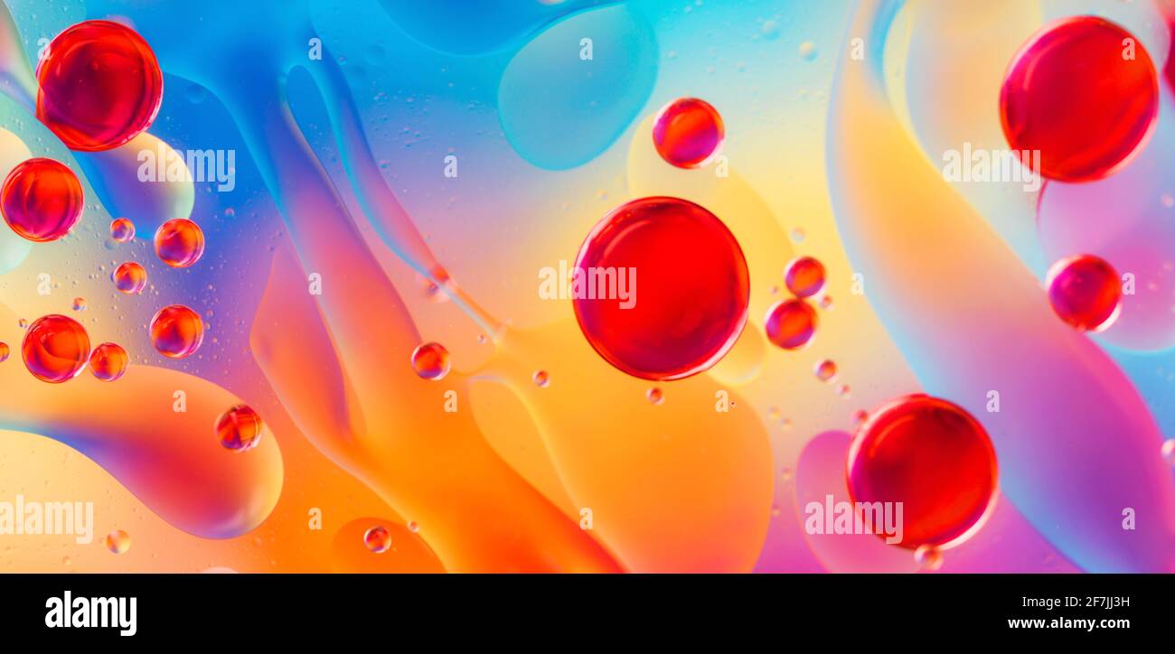 abstract colorful backdrop with oil drops and waves on water surface Stock Photo