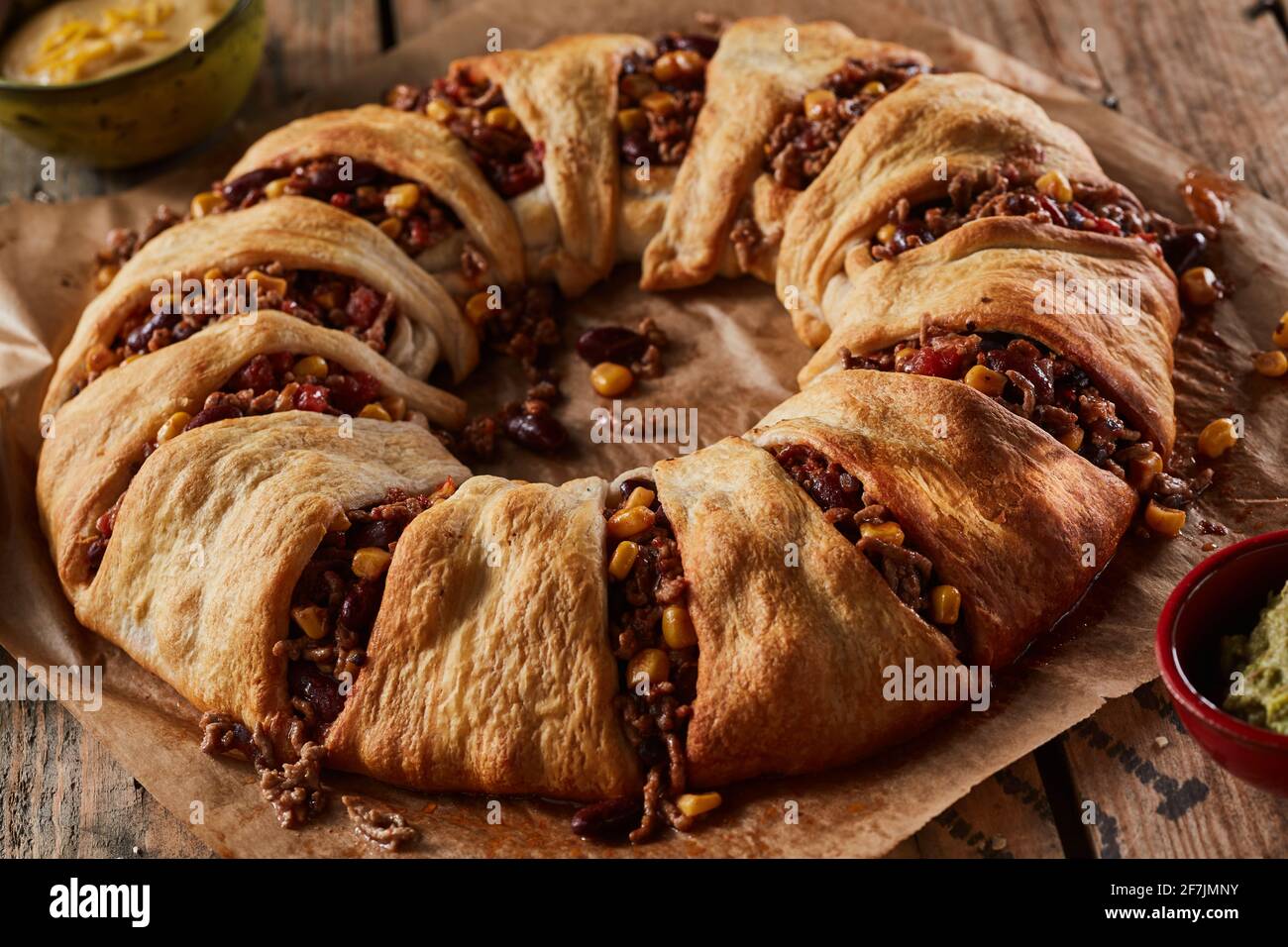 Closeup of appetizing baked Mexican dish enchilada crescent ring made