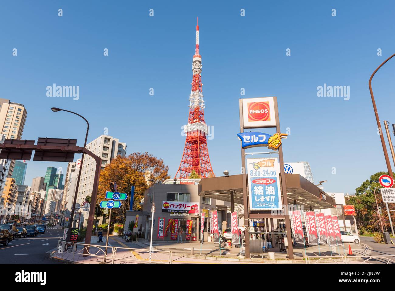 Tokyo, Japan - December 09, 2015: Tokyo Tower near an ENEOS Petrol Station. ENEOS corporation is a Japanese petroleum company. Stock Photo