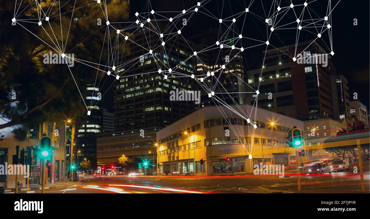 Composition of net of connections over a cityscape in background Stock Photo