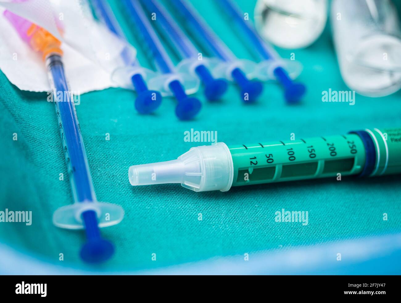 Syringes of insulin medication next to medicine vials prepared in hospital, conceptual image Stock Photo