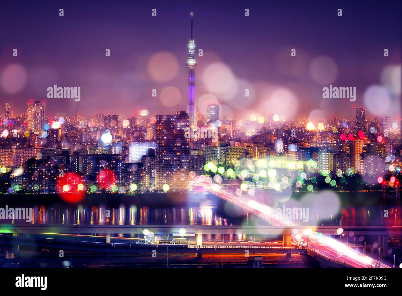Nightlife in Tokyo. Tokyo Sky Tree with Blur Bokeh Lights Decoration in Colorful Filter. Tokyo Cityscape Background. Night sky and nightlife concept Stock Photo