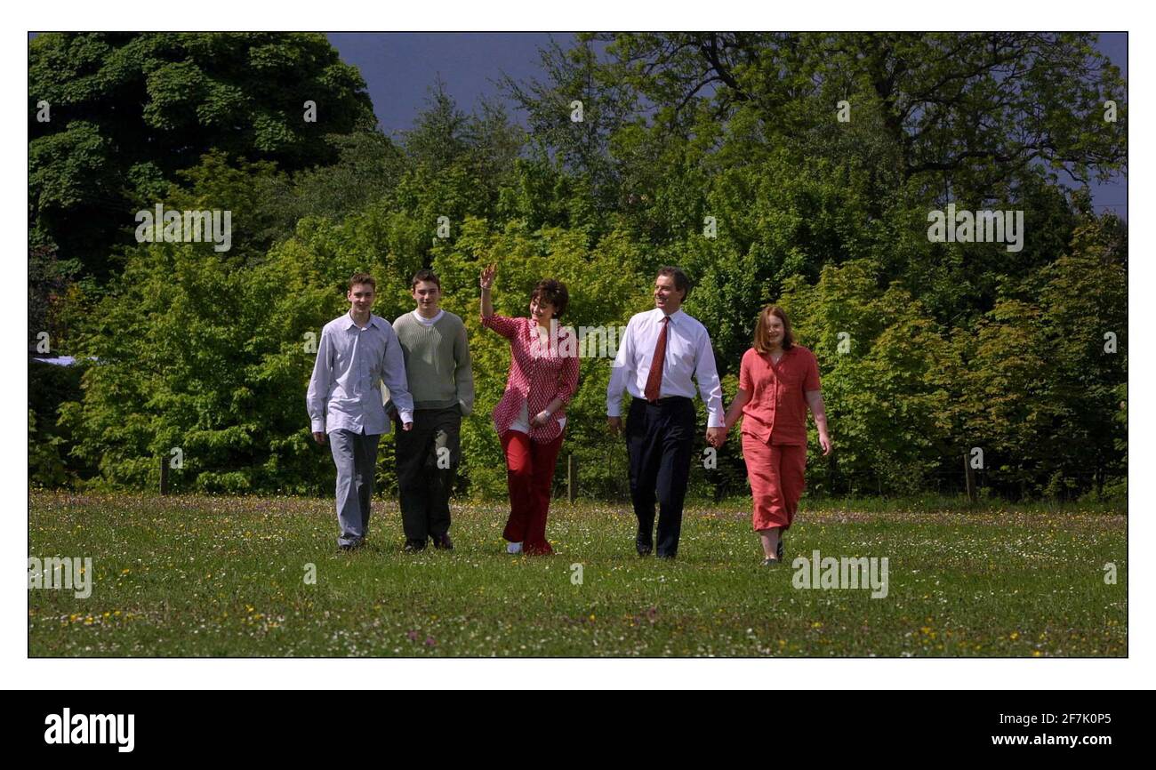 The General Election June 2001  Tony Blair and his family walk the short 200 yards across a football field to the polling booth in Trimdon near Sedgefield where he and Cherrie voted today. Children are Euan, Nicky and Kathryn Stock Photo