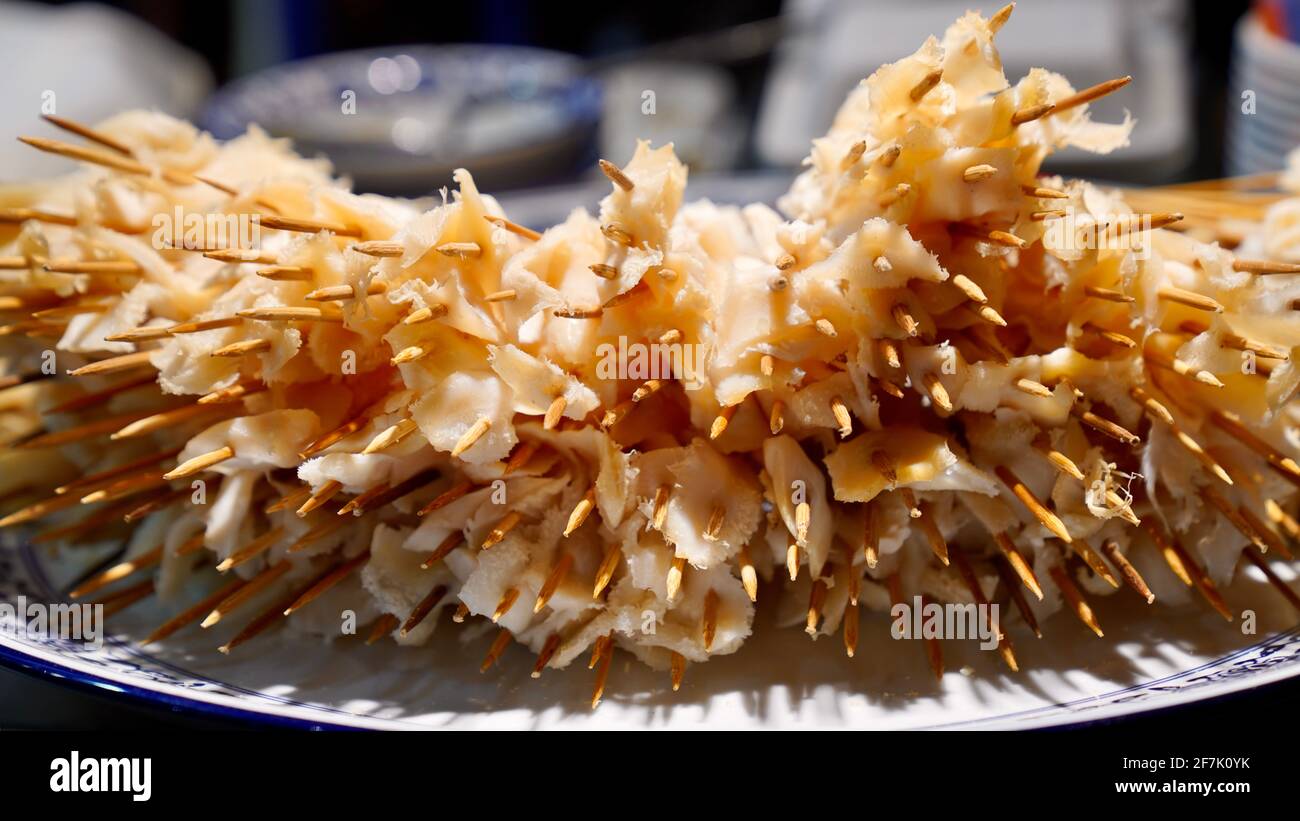 Piles of ox tripe on bamboo skewer, a traditional Chinese food for spicy hot pot. Stock Photo
