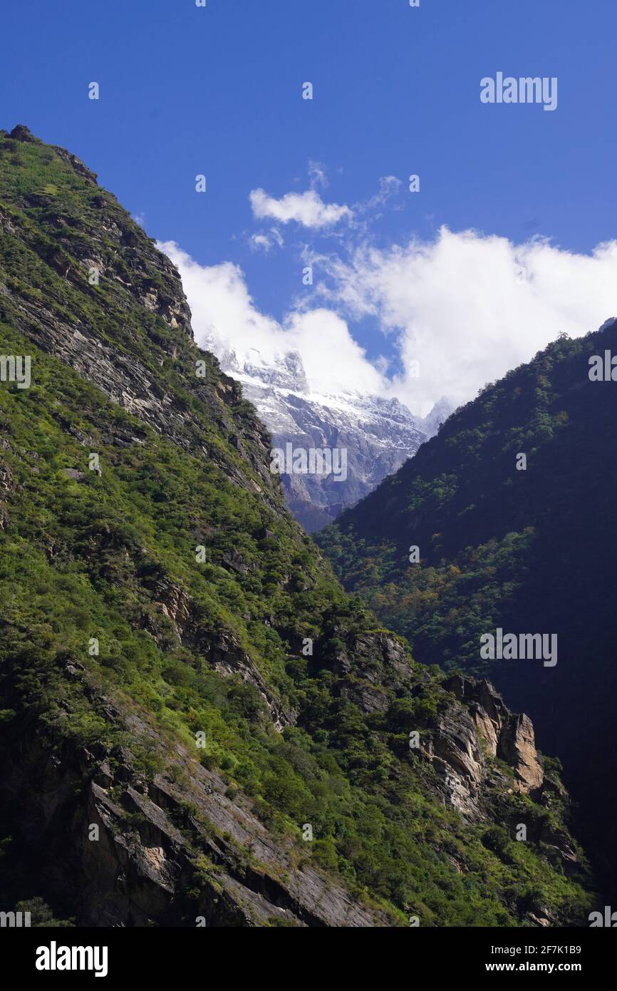 Green mountains with cloudy and blue sky above Stock Photo - Alamy