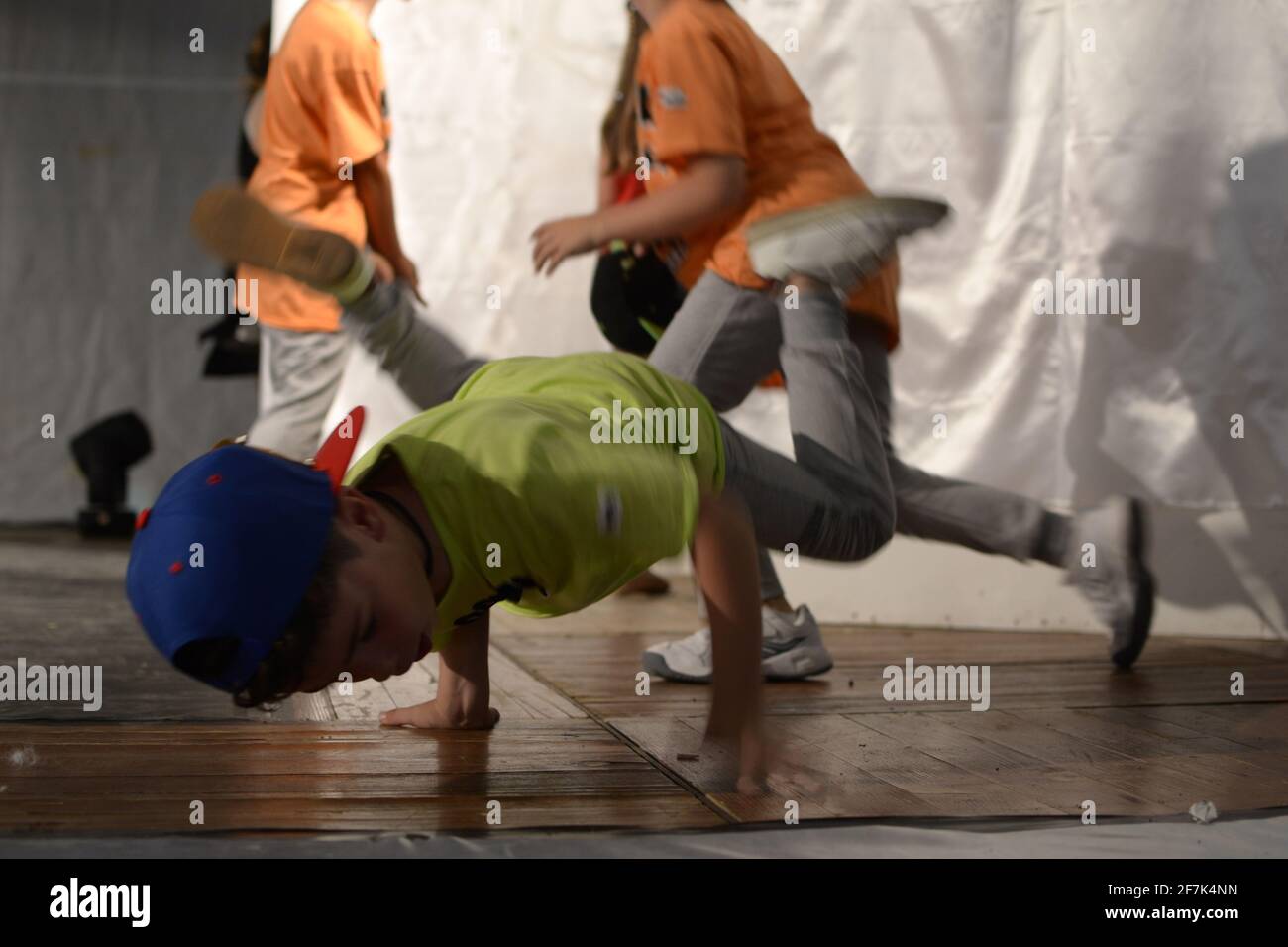 Boy dancing breakdance in frozen child position. Baby freeze breakdance. Stock Photo