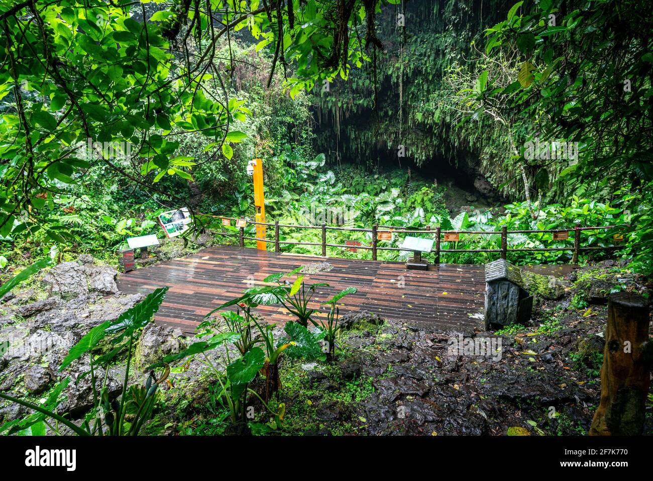 Haikou China , 22 March 2021 : Viewing deck at the bottom of the crater of Fengluling volcano full of green vegetation at Huoshankou volcanic cluster Stock Photo