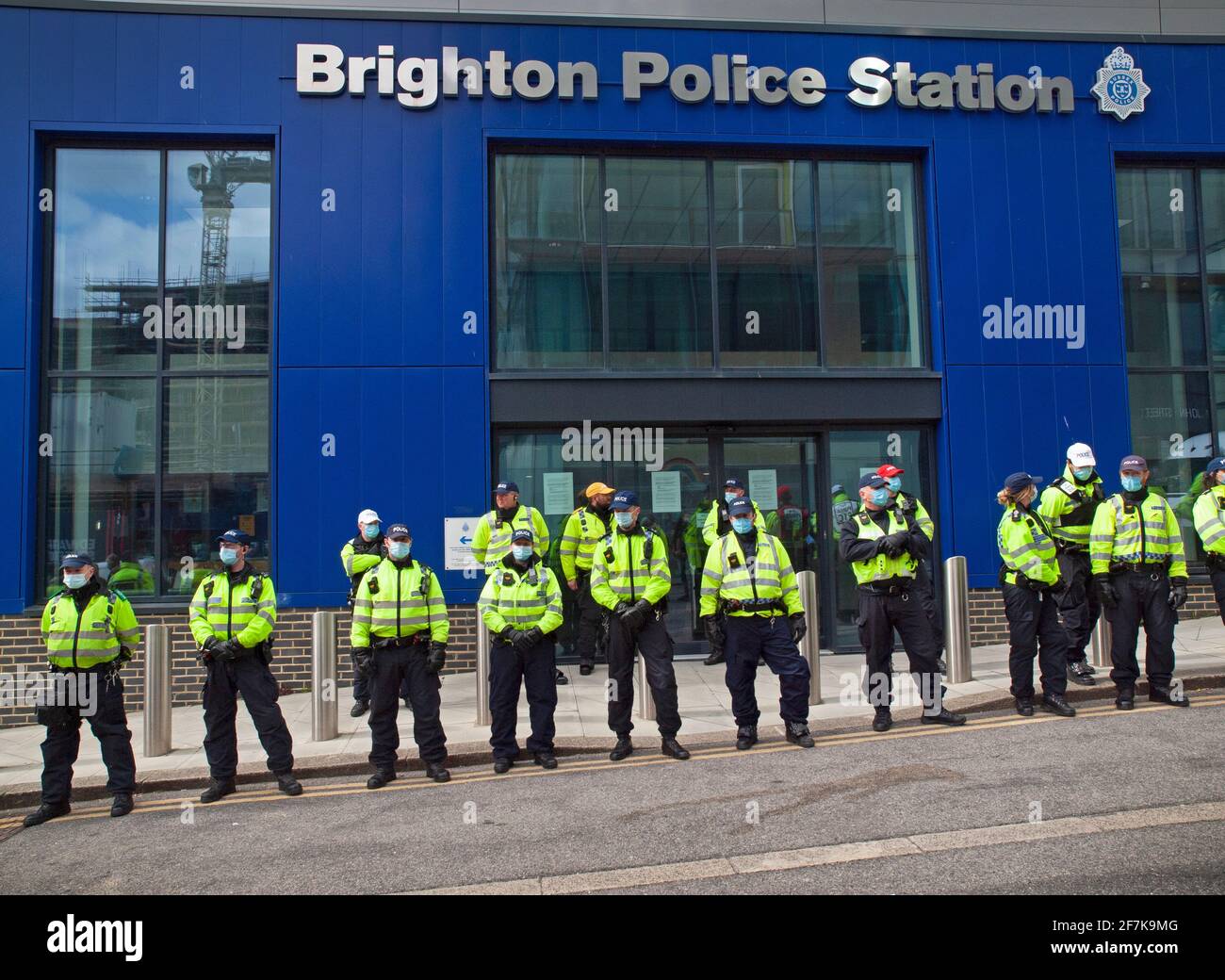 The police stand guard outside their station during a Kill the Bill demonstration Stock Photo