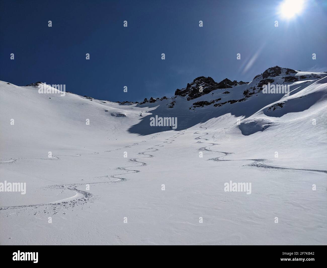 ski touring track. Freeride in powder snow above Elm. Big mountains in Switzerland. Ski touring mountaineering. Sun fun Stock Photo