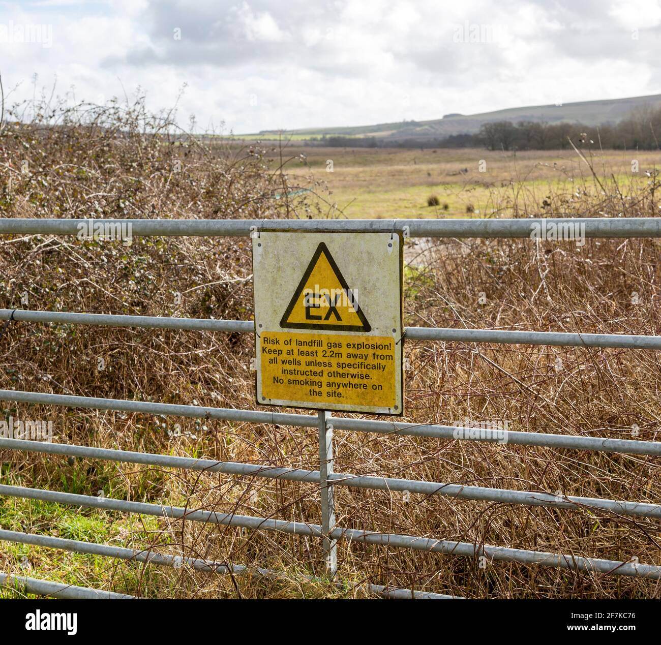 Sign warning of danger of gas explosion at landfill site, Hills waste management, Calne, Wiltshire, England, UK Stock Photo