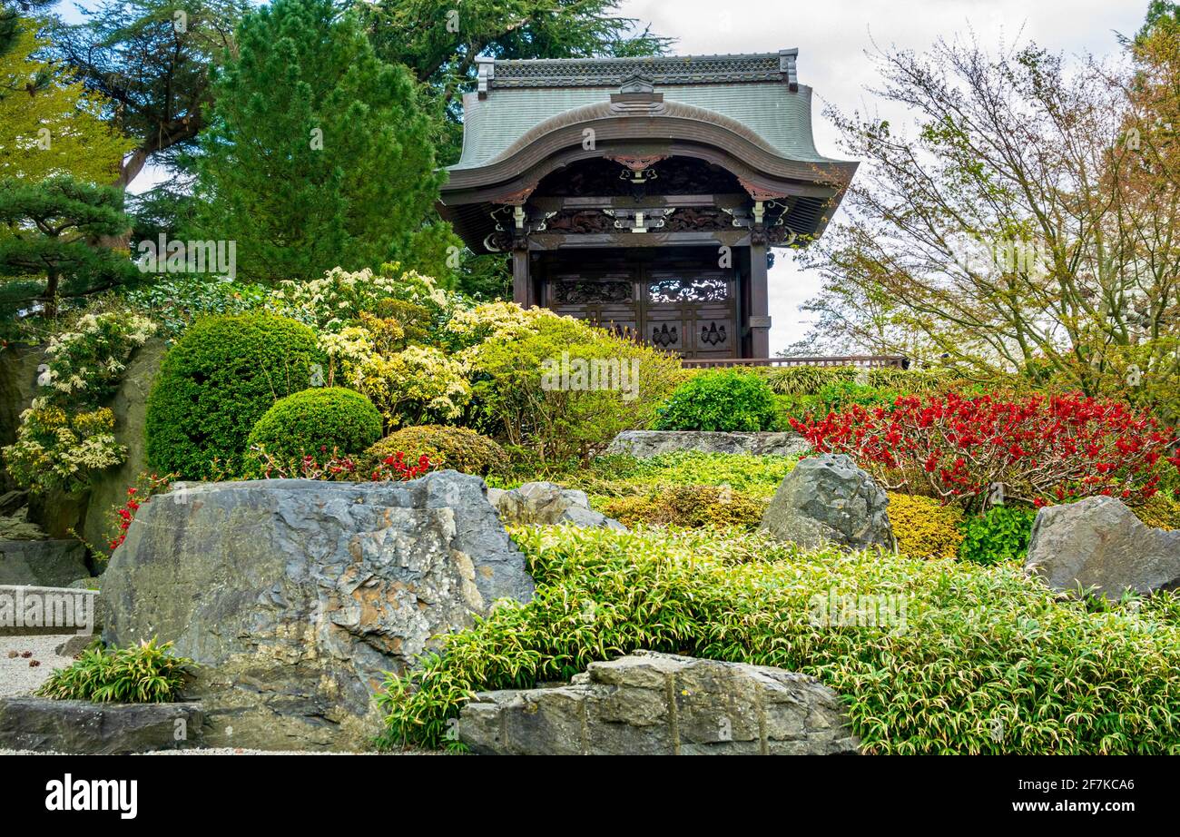 Beautiful Japanese Garden of Peace and Chokushi-Mon (Japanese Gateway) within Kew Gardens, London, U.K. Spring flowers in bloom. Stock Photo