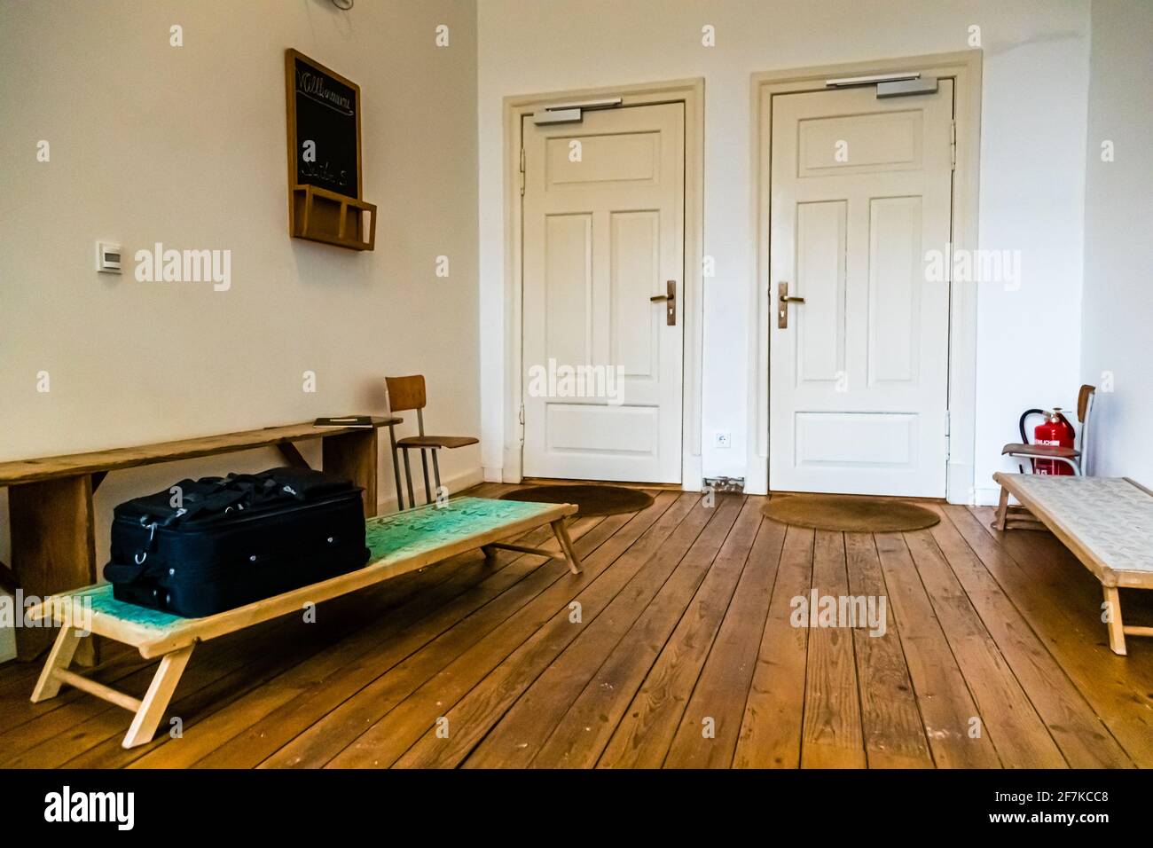 Once a child's cot for the prescribed nap, today only the guests' luggage rests here Stock Photo