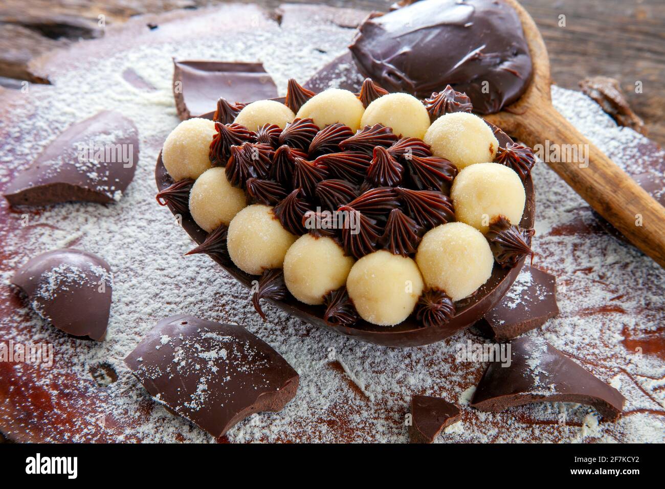 Brazilian easter egg stuffed with chocolate and cream, tasted with a spoon. Easter tradition in