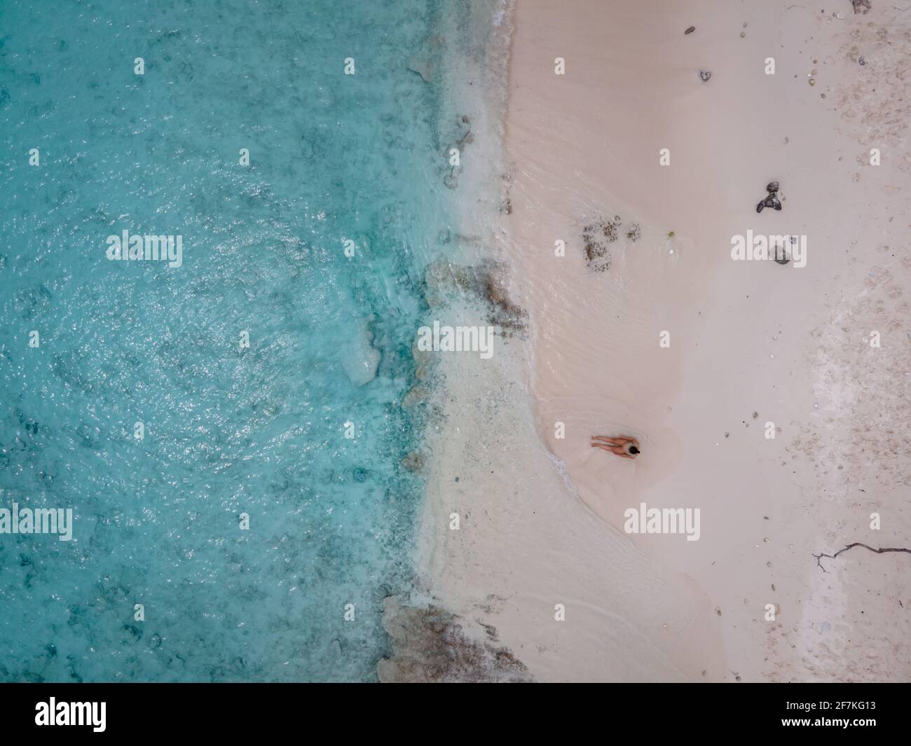 Aerial view of the coast of Curacao in the Caribbean Sea with turquoise water, white sandy beach, and beautiful coral reef at Playa Cas Abao Curacao Stock Photo