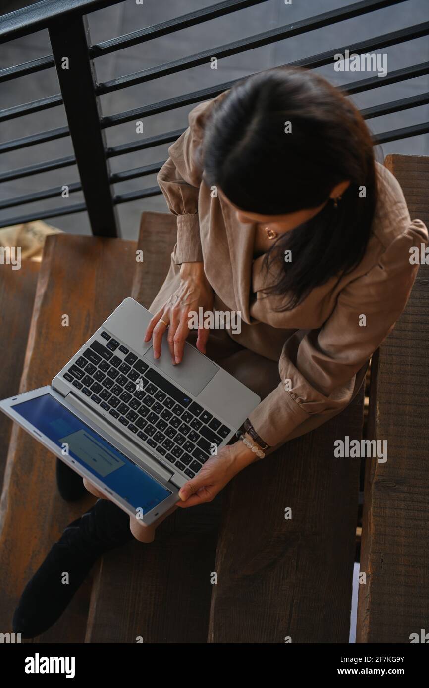 top view of girl working on laptop Stock Photo