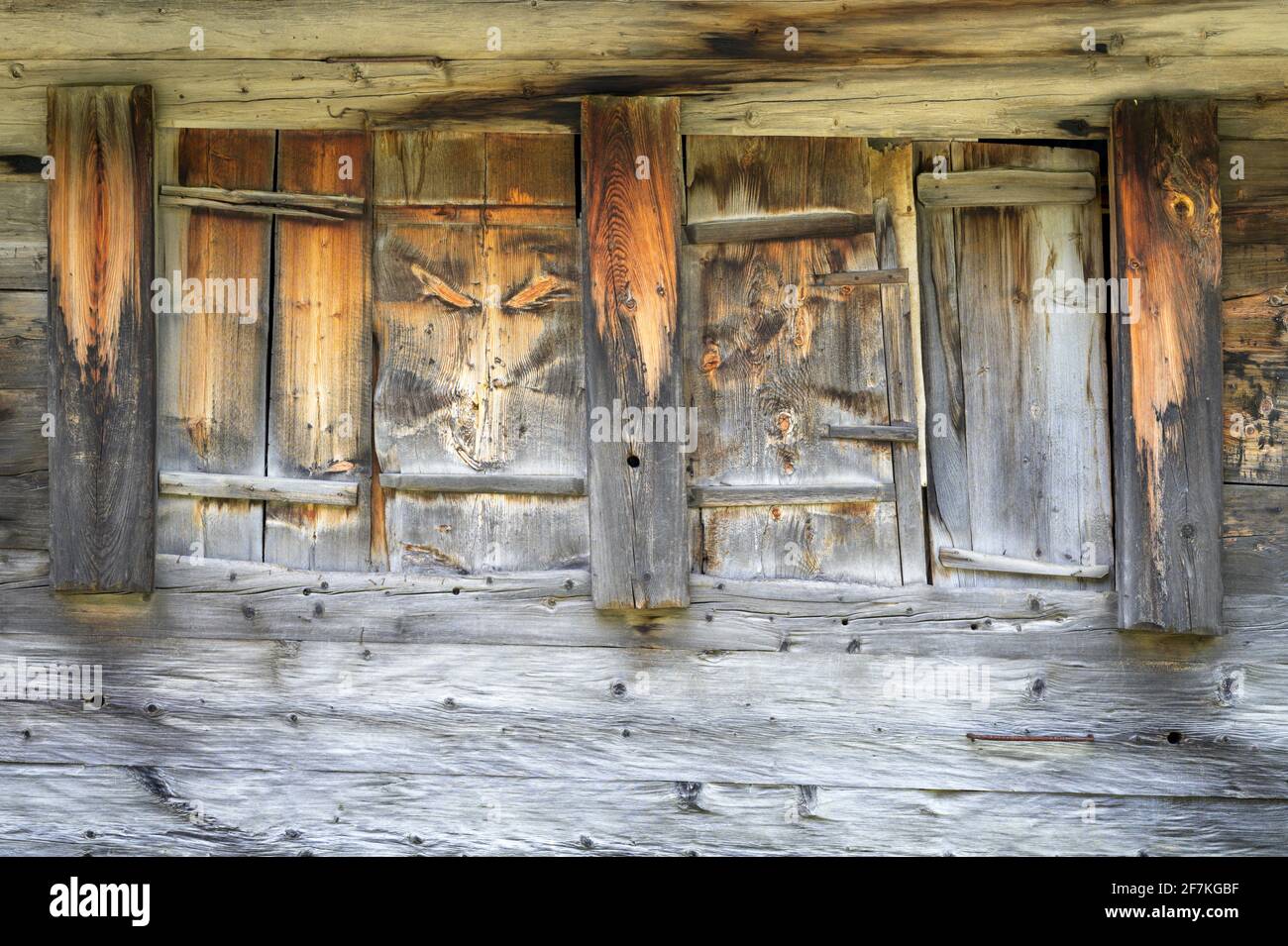 Rustic wooden window shutters, alpine barn, Oberwald, Switzerland Stock Photo