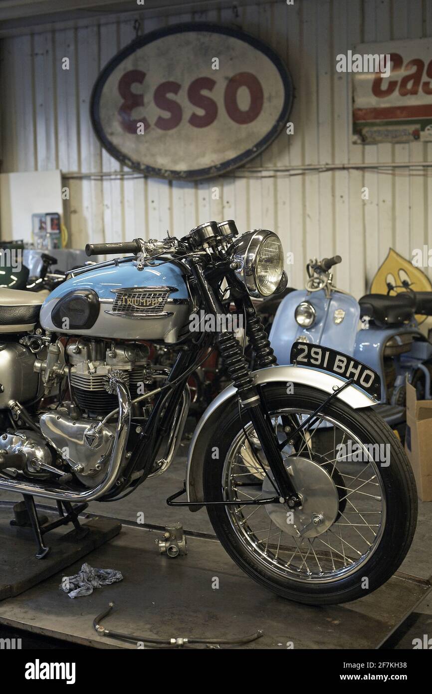 Classic Triumph Bonneville at garage workshop in London , UK Stock Photo