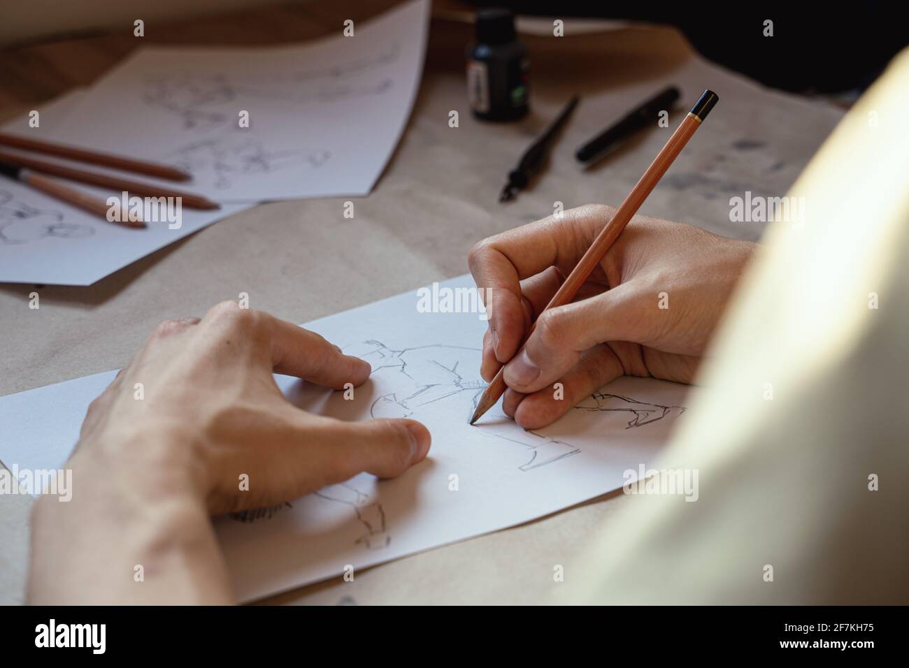 Artist drawing figure pencil sketches. Artwork background Stock Photo