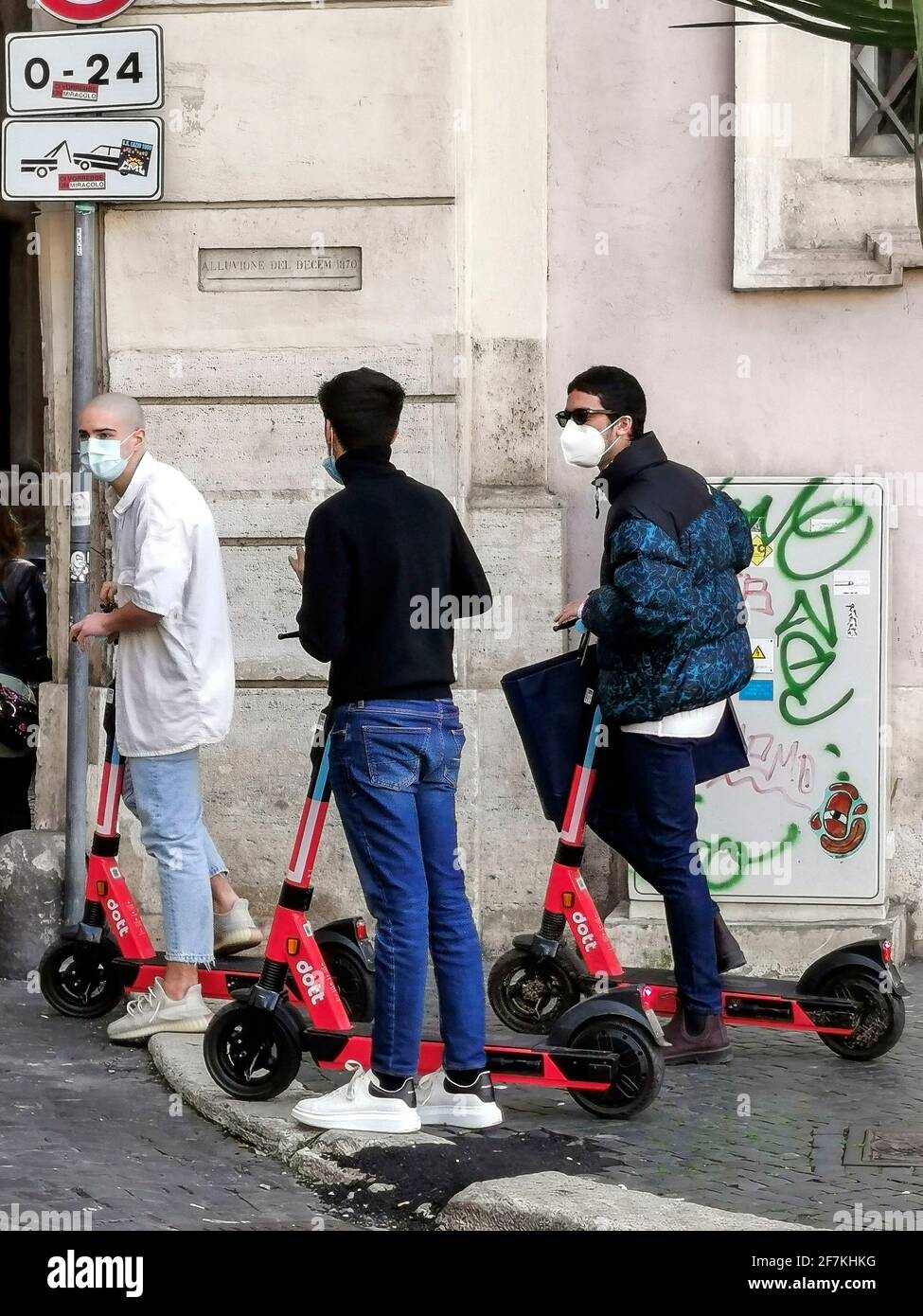 Italy, Rome, March 13, 2021 : People riding an electric  scooter across Rome   Photo © Fabio Mazzarella/Sintesi/Alamy Stock Photo Stock Photo