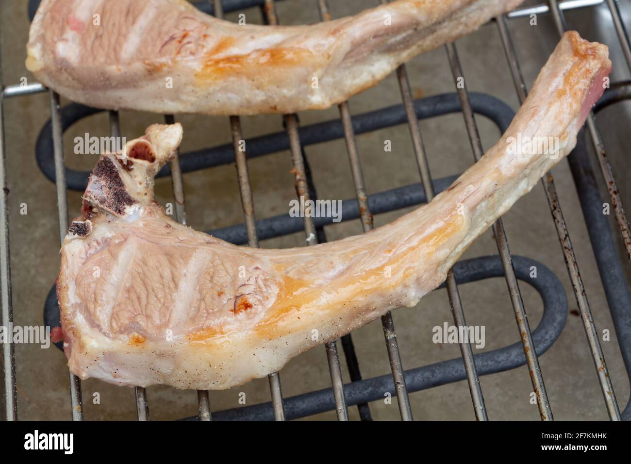 Lamb chops grilling on electric barbecue Stock Photo