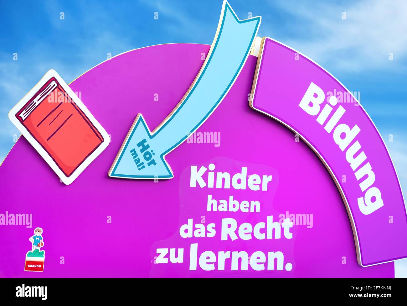 Poster with lettering: Bildung, Kinder haben das Recht zu lernen. Education, Children have the right to learn. Stock Photo