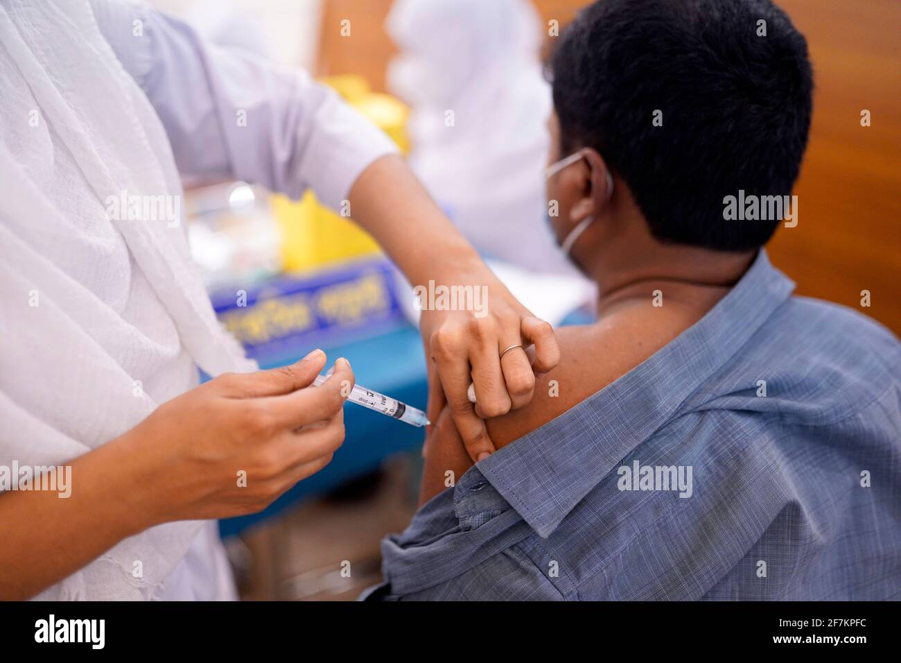 Dhaka, Bangladesh. 08th Apr, 2021. A Bangladeshi citizen receives an Oxford-AstraZeneca vaccine during the second dose of coronavirus vaccination campaign at Bangabandhu Sheikh Mujib Medical University (BSMMU). (Photo by Sultan Mahmud Mukut/SOPA Images/Sipa USA) Credit: Sipa USA/Alamy Live News Stock Photo