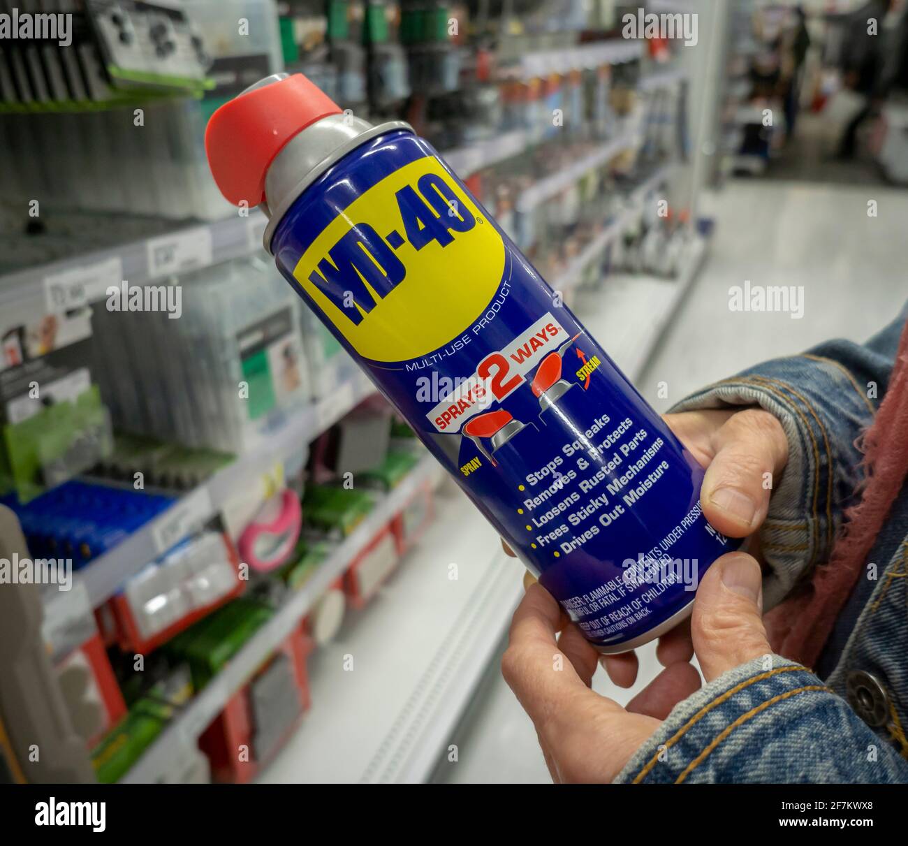 New York, USA. 15th Oct, 2018. A shopper buys a can of WD-40 spray lubricant in a store in New York on Monday, October 15, 2018. (Photo by Richard B. Levine) Credit: Sipa USA/Alamy Live News Stock Photo